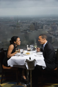 African-American couple having dinner at the Tower of the Americas in San Antonio Texas.